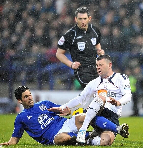 Intense Battle for Ball Possession: Mikel Arteta vs. Paul Robinson, Everton vs. Bolton Wanderers (Barclays Premier League, 13 February 2011, Reebok Stadium)