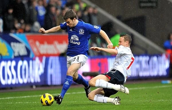 Intense Battle for Ball Possession: Seamus Coleman vs. Matthew Taylor, Everton vs. Bolton Wanderers, Barclays Premier League (February 13, 2011)