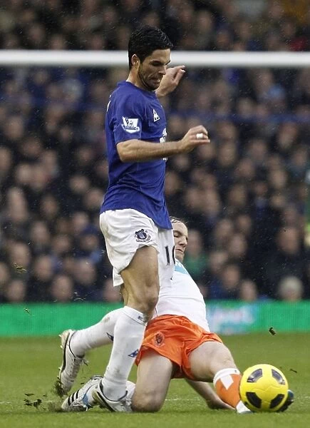 Intense Battle: Mikel Arteta vs. David Vaughan at Goodison Park - Everton vs. Blackpool, Barclays Premier League (2011)