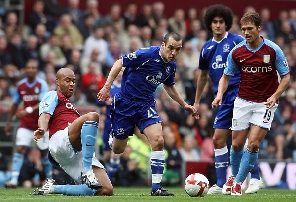 Intense Battle: Osman vs. Knight in Aston Villa vs. Everton Premier League Clash