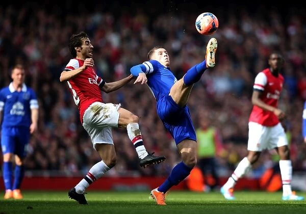 Intense Battle for Possession: Flamini vs. Barkley in FA Cup Sixth Round Clash between Arsenal and Everton