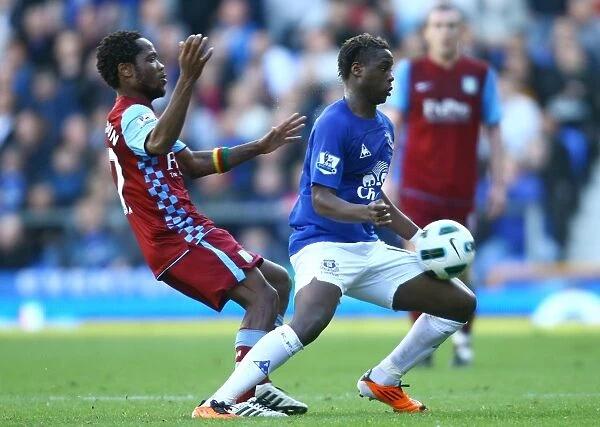 Intense Battle for Possession: Magaye Gueye vs Jean Makoun (Everton vs Aston Villa, Barclays Premier League, Goodison Park, 04 April 2011)