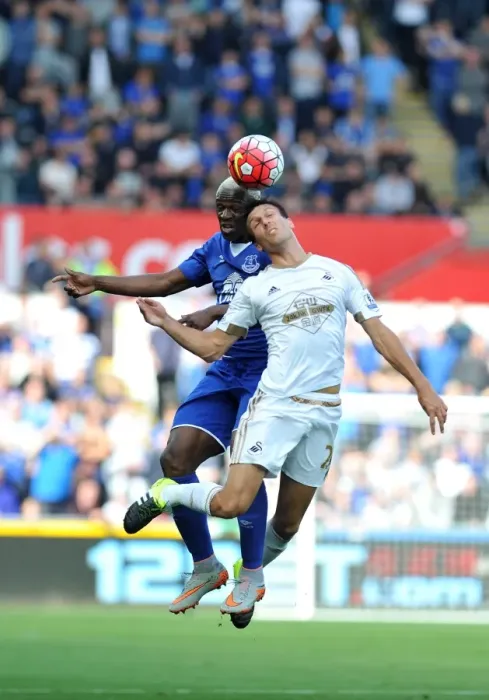 Framed Print : Intense Face-off: Jack Cork vs. Arouna Kone at Swansea City's Liberty Stadium