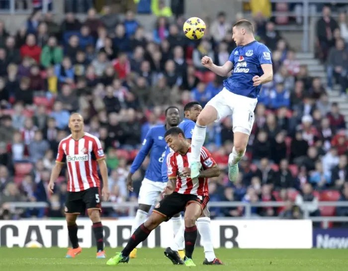 Framed Print : Intense Header Battle: McCarthy vs Bridcutt in Sunderland vs Everton Premier League Clash Framed Print : Intense Header Battle: McCarthy vs Bridcutt in Sunderland vs Everton Premier League Clash