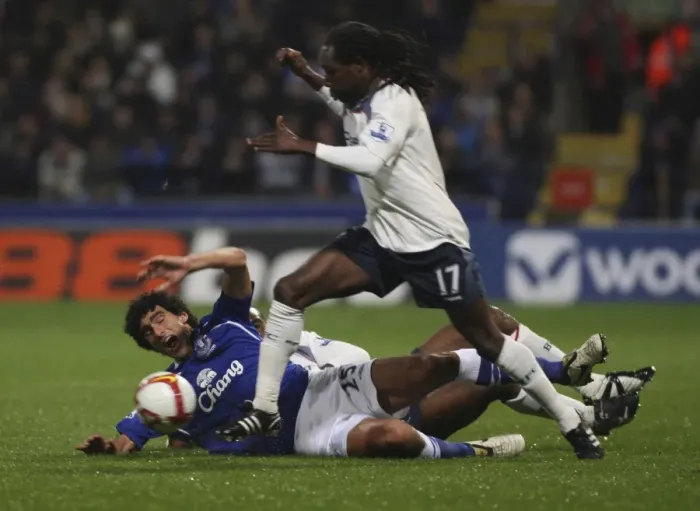 Framed Print : Intense Moment: Fellaini vs. Riga in Bolton vs. Everton Premier League Clash (2008) Framed Print : Intense Moment: Fellaini vs. Riga in Bolton vs. Everton Premier League Clash (2008)