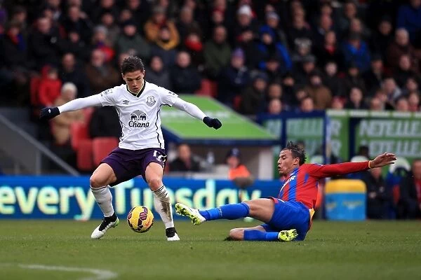 Intense Rivalry: Besic vs Chamakh Battle for Ball in Everton vs Crystal Palace Premier League Clash