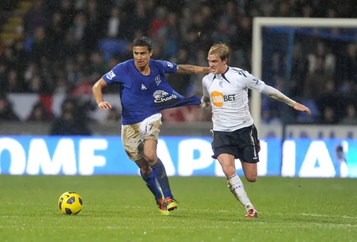 Framed Print : Intense Rivalry: Cahill vs. Holden's Battle for Ball Possession - Everton vs. Bolton Wanderers, Barclays Premier League (2011) Framed Print : Intense Rivalry: Cahill vs. Holden's Battle for Ball Possession - Everton vs. Bolton Wanderers, Barclays Premier League (2011)