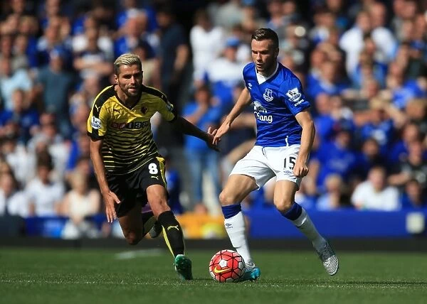Intense Rivalry: Cleverley vs Behrami's Battle for Ball Possession (Everton vs Watford, Premier League)