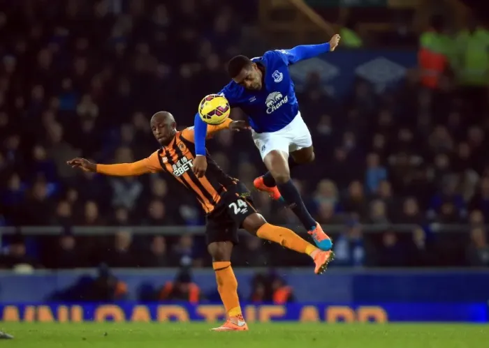 Framed Print : Intense Rivalry: Distin vs. Aluko - Everton vs. Hull City Clash at Goodison Park Framed Print : Intense Rivalry: Distin vs. Aluko - Everton vs. Hull City Clash at Goodison Park