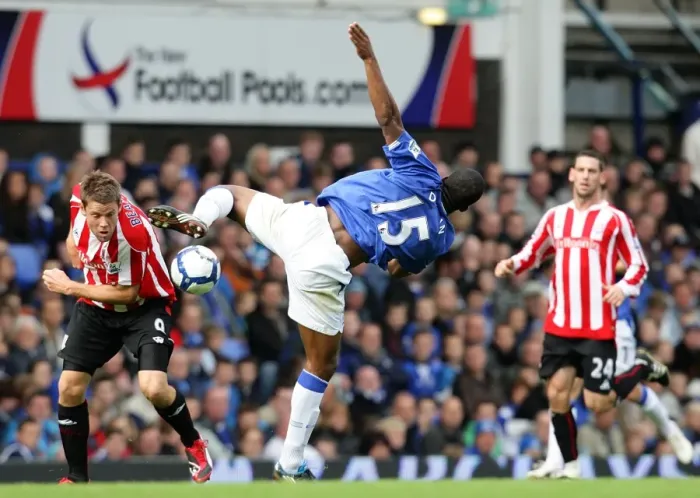 Framed Print : Intense Rivalry: Distin vs Beattie Battle for Ball at Goodison Park - Everton vs Stoke City, Premier League Framed Print : Intense Rivalry: Distin vs Beattie Battle for Ball at Goodison Park - Everton vs Stoke City, Premier League