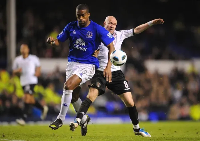 Framed Print : Intense Rivalry: Distin vs. Johnson - Everton vs. Fulham, Premier League Showdown (19 March 2011, Goodison Park)