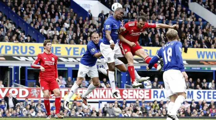 Framed Print : Intense Rivalry: Distin vs. Kyrgiakos Aerial Battle in the Everton vs. Liverpool Premier League Clash (October 2010) Framed Print : Intense Rivalry: Distin vs. Kyrgiakos Aerial Battle in the Everton vs. Liverpool Premier League Clash (October 2010)