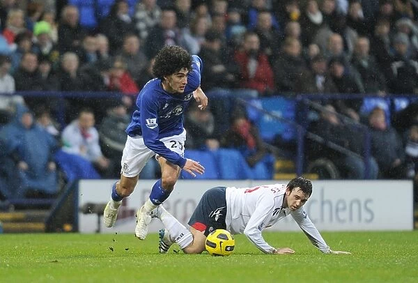 Intense Rivalry: Fellaini vs. Davies Battle at Reebok Stadium - Everton vs. Bolton Wanderers (BPL, 13 February 2011)