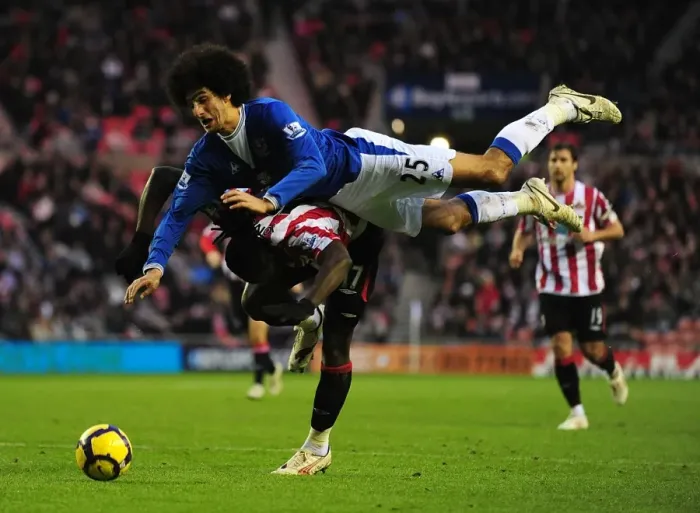 Framed Print : Intense Rivalry: Fellaini vs. Jones - A Battle for Supremacy in the Premier League