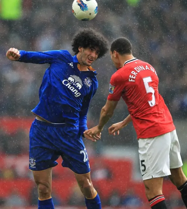 Framed Print : Intense Rivalry: Ferdinand vs. Fellaini - Battle for Ball (April 2012, Old Trafford) Framed Print : Intense Rivalry: Ferdinand vs. Fellaini - Battle for Ball (April 2012, Old Trafford)