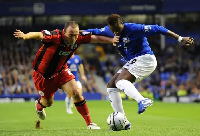 Framed Print : Intense Rivalry on the Football Field: Magaye Gueye vs. Lee Croft