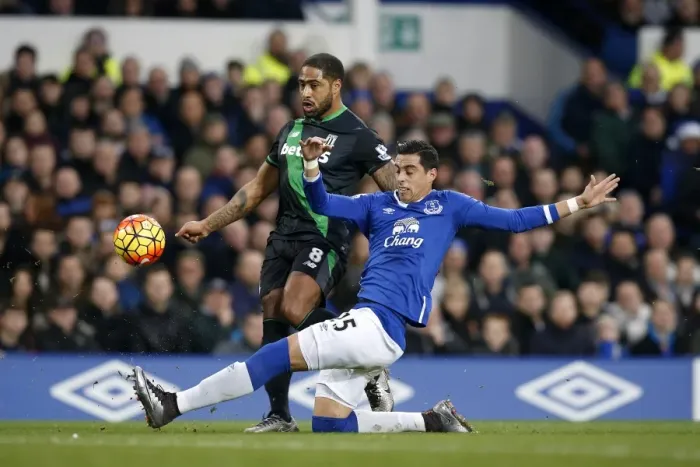 Framed Print : Intense Rivalry: Funes Mori vs. Johnson - Everton vs. Stoke City Football Showdown