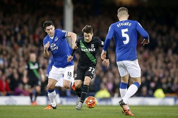 Intense Rivalry: Gareth Barry vs Bojan Krkic - Everton vs Stoke City's Battle for Supremacy at Goodison Park