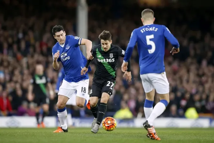 Framed Print : Intense Rivalry: Gareth Barry vs Bojan Krkic - Everton vs Stoke City's Battle for Supremacy at Goodison Park