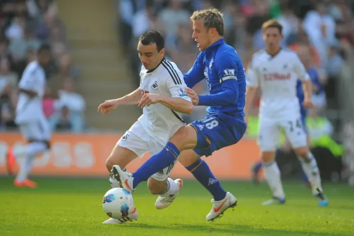 Framed Print : Intense Rivalry: Phil Neville vs. Leon Britton - Everton vs. Swansea City Clash in the Barclays Premier League (24 March 2012, Liberty Stadium) Framed Print : Intense Rivalry: Phil Neville vs. Leon Britton - Everton vs. Swansea City Clash in the Barclays Premier League (24 March 2012, Liberty Stadium)