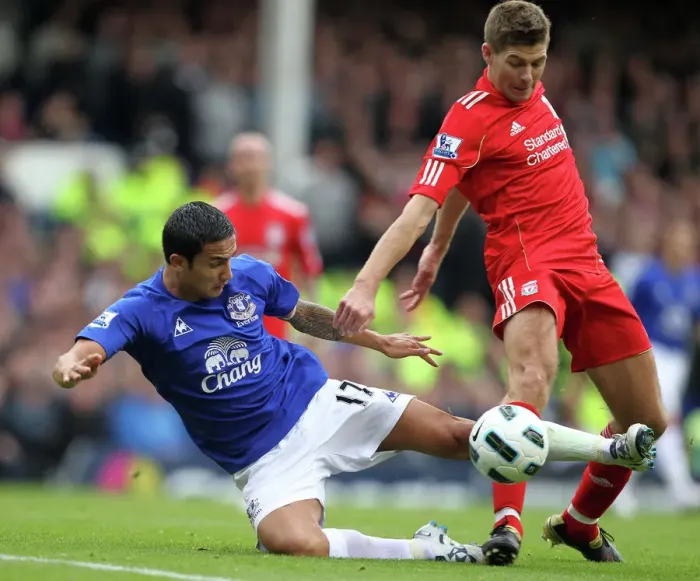 Framed Print : Intense Rivalry: Tim Cahill vs Steven Gerrard Battle for the Ball at Goodison Park Framed Print : Intense Rivalry: Tim Cahill vs Steven Gerrard Battle for the Ball at Goodison Park
