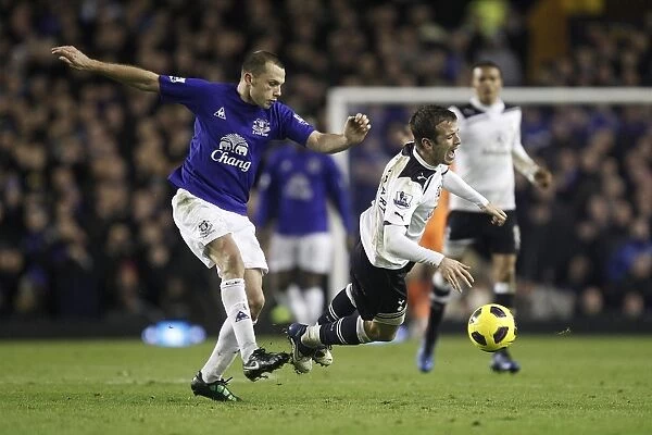 Intense Rivalry: Van der Vaart vs. Heitinga Battle at Goodison Park - Everton vs. Tottenham Hotspur, Barclays Premier League (05 January 2011)