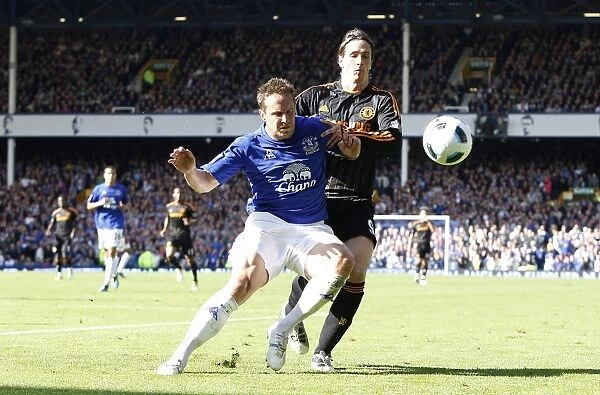 Jagielka vs. Torres: A Premier League Battle at Goodison Park (Everton vs. Chelsea, May 2011)
