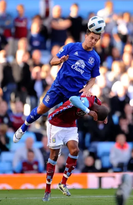 Framed Print : Jagielka's Dominance: Everton's Phil Jagielka Outmuscles Young in Aston Villa vs Everton (Barclays Premier League, 29 August 2010, Villa Park) Framed Print : Jagielka's Dominance: Everton's Phil Jagielka Outmuscles Young in Aston Villa vs Everton (Barclays Premier League, 29 August 2010, Villa Park)
