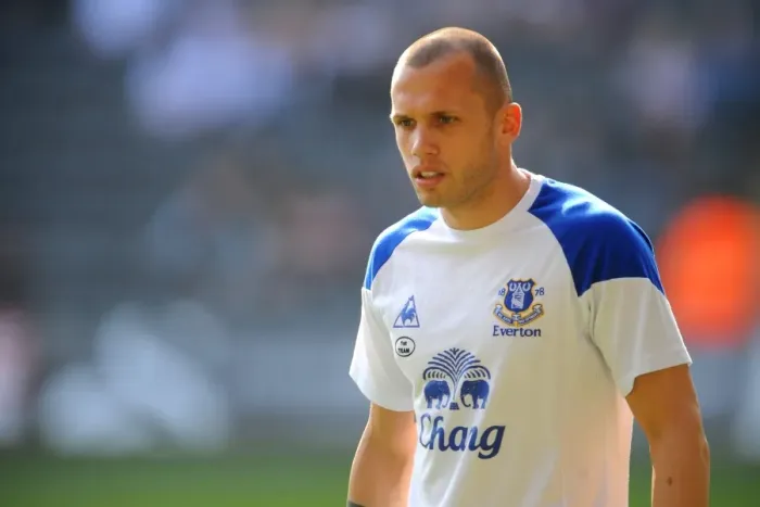 Framed Print : John Heitinga vs Swansea City: A Fierce Face-Off at Liberty Stadium (BPL, 24 March 2012)