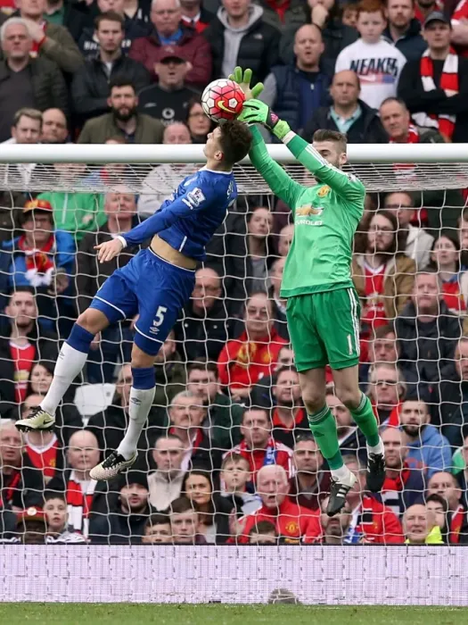 Framed Print : John Stones vs. David de Gea: Intense Battle for the Ball at Old Trafford - Manchester United vs. Everton, Premier League