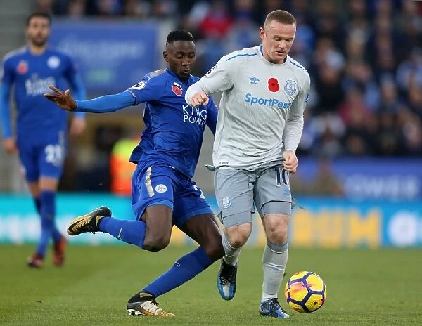 Leicester City vs Everton: Intense Battle for the Ball between Wilfred Ndidi and Wayne Rooney