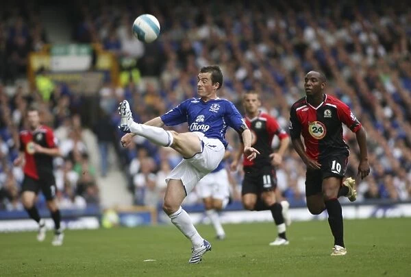 Leighton Baines vs Benni McCarthy: A Premier League Battle at Goodison Park, Everton vs Blackburn Rovers (07 / 08)