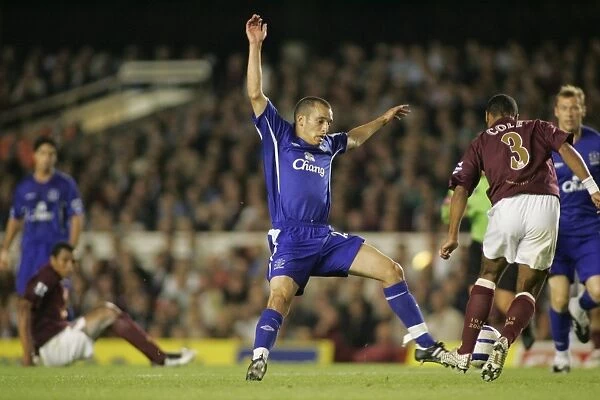 Leon Osman. Osman tries to win the ball from Ashley Cole
