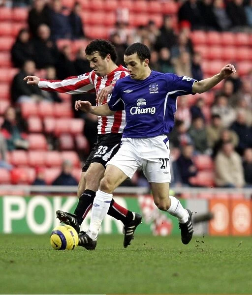 Leon Osman. Ossie gets to grips with Julio Arca