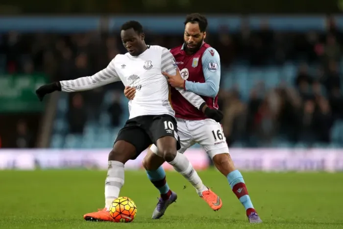Framed Print : Lukaku vs. Lescott: A Premier League Battle for Ball Possession