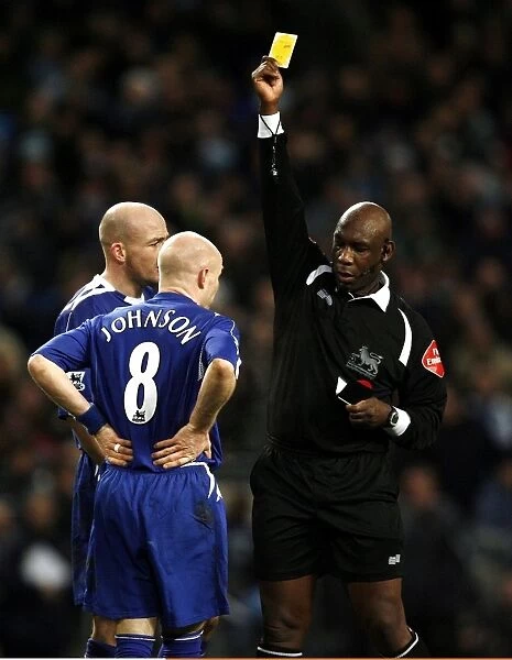Manchester City v Everton - Andrew Johnson receives a yellow card from referee Uriah Rennie