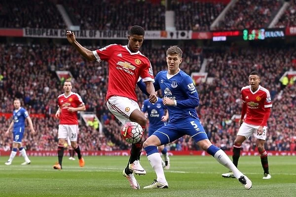 Manchester United vs. Everton: Rashford vs. Stones - Intense Battle for Ball Possession (Barclays Premier League)