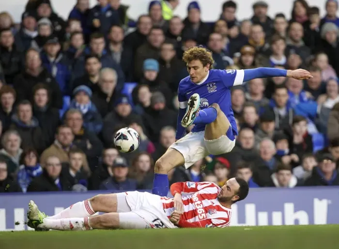 Framed Print : Marc Wilson's Sliding Tackle on Nikica Jelavic: Everton's 1-0 Win Over Stoke City at Goodison Park (March 30, 2013)