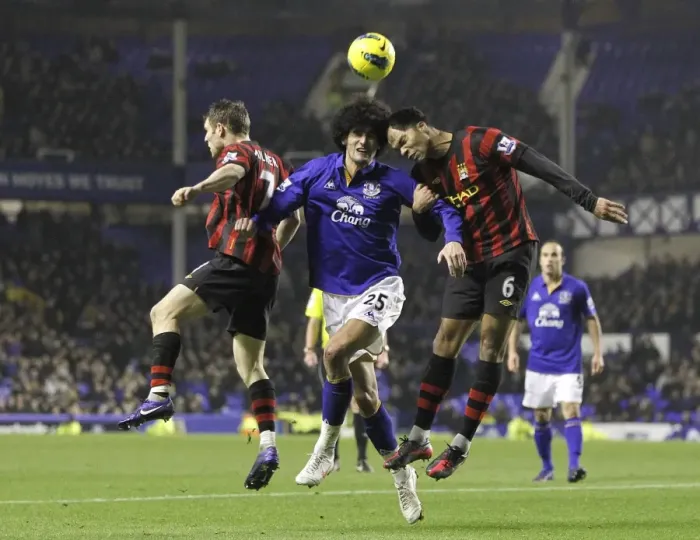 Framed Print : Marouane Fellaini vs Milner & Lescott: Everton's Midfield Battle against Manchester City (31 January 2012) Framed Print : Marouane Fellaini vs Milner & Lescott: Everton's Midfield Battle against Manchester City (31 January 2012)