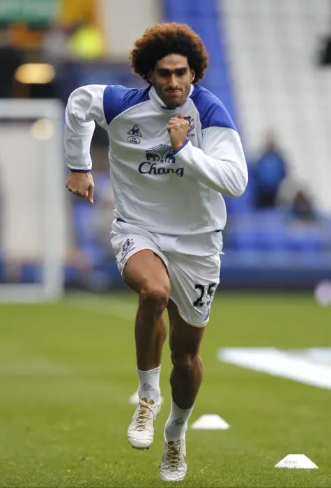 Framed Print : Marouane Fellaini's Intense Pre-Match Focus: Everton vs Manchester United (Premier League, 29 October 2011)
