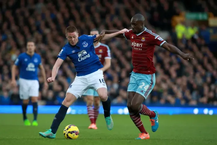 Framed Print : McCarthy vs. Cole: Intense Battle for Ball in Everton vs. West Ham Premier League Clash Framed Print : McCarthy vs. Cole: Intense Battle for Ball in Everton vs. West Ham Premier League Clash