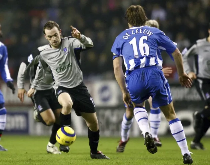 Framed Print : McFadden vs. De Zeeuw: A Football Battle at Everton Framed Print : McFadden vs. De Zeeuw: A Football Battle at Everton