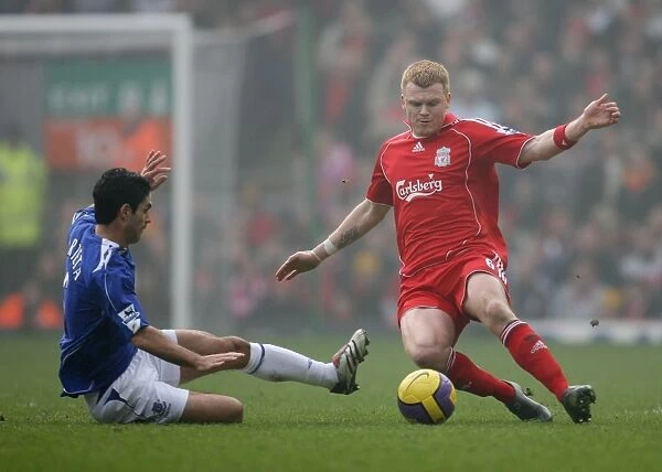 Mikel Arteta in action against Liverpools John Arne Riise