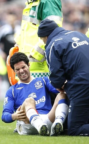 Mikel Arteta Suffers Injury: Everton's Midfielder Carried Off in Newcastle Clash (2009)