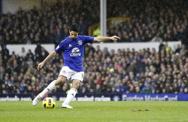 Mikel Arteta's Determined Shot: Everton's Pursuit for Victory vs. Blackpool (05 February 2011, Barclays Premier League)