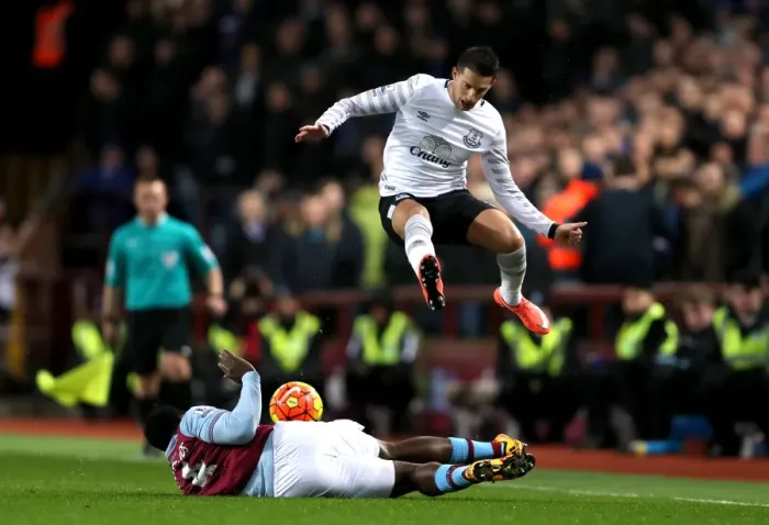 Framed Print : Mirallas Soars Past Richards: Thrilling Moment from Aston Villa vs. Everton in the Premier League Framed Print : Mirallas Soars Past Richards: Thrilling Moment from Aston Villa vs. Everton in the Premier League