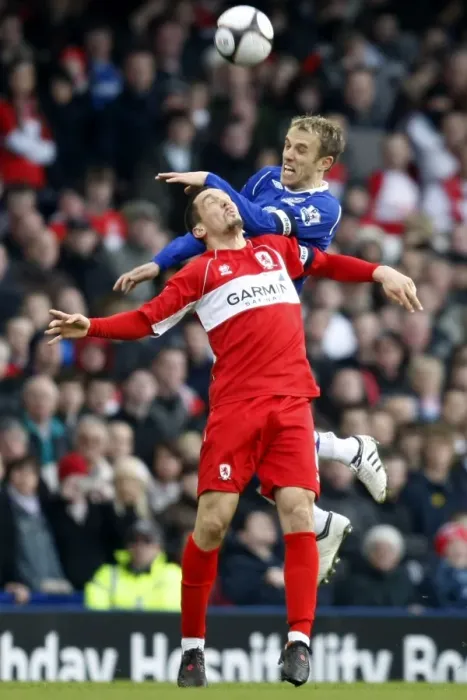 Framed Print : Neville vs Pogatetz: Everton vs Middlesbrough FA Cup Quarterfinal Showdown at Goodison Park Framed Print : Neville vs Pogatetz: Everton vs Middlesbrough FA Cup Quarterfinal Showdown at Goodison Park