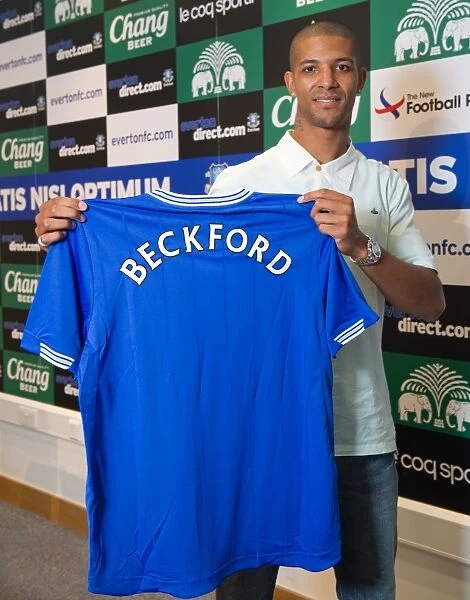New Signing Jermaine Beckford Poses with Everton Shirt at Finch Farm