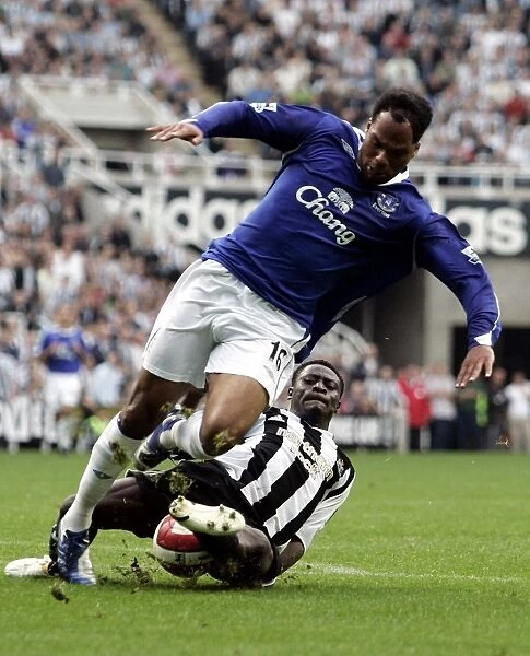 Newcastles Obafemi Martins tackles Evertons Joleon Lescott