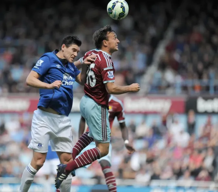 Framed Print : Noble vs. Barry: A Battle of Midfield Masters in the Barclays Premier League - West Ham United vs. Everton at Upton Park